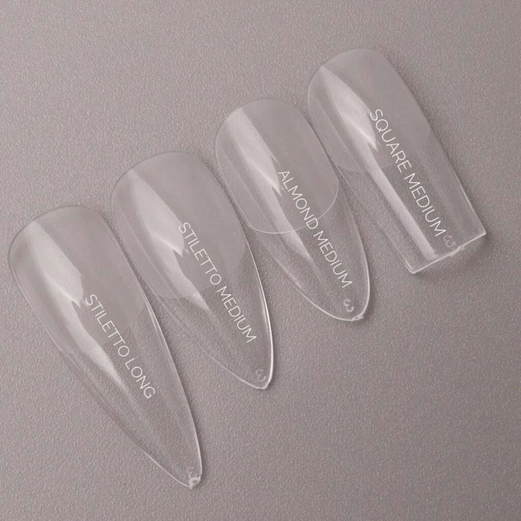 Tips transparentes de soft gel en formas stiletto, almendra y cuadrada